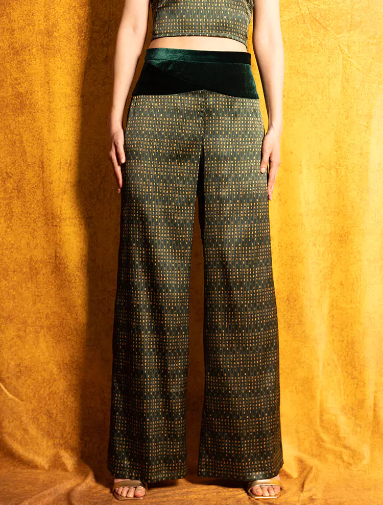 A close up of the Velvet Poem high-waisted pants which features a custom print inspired by Chinese landscape poetry and a velvet waistband. She exudes grace in this Modern Chinese chic style.