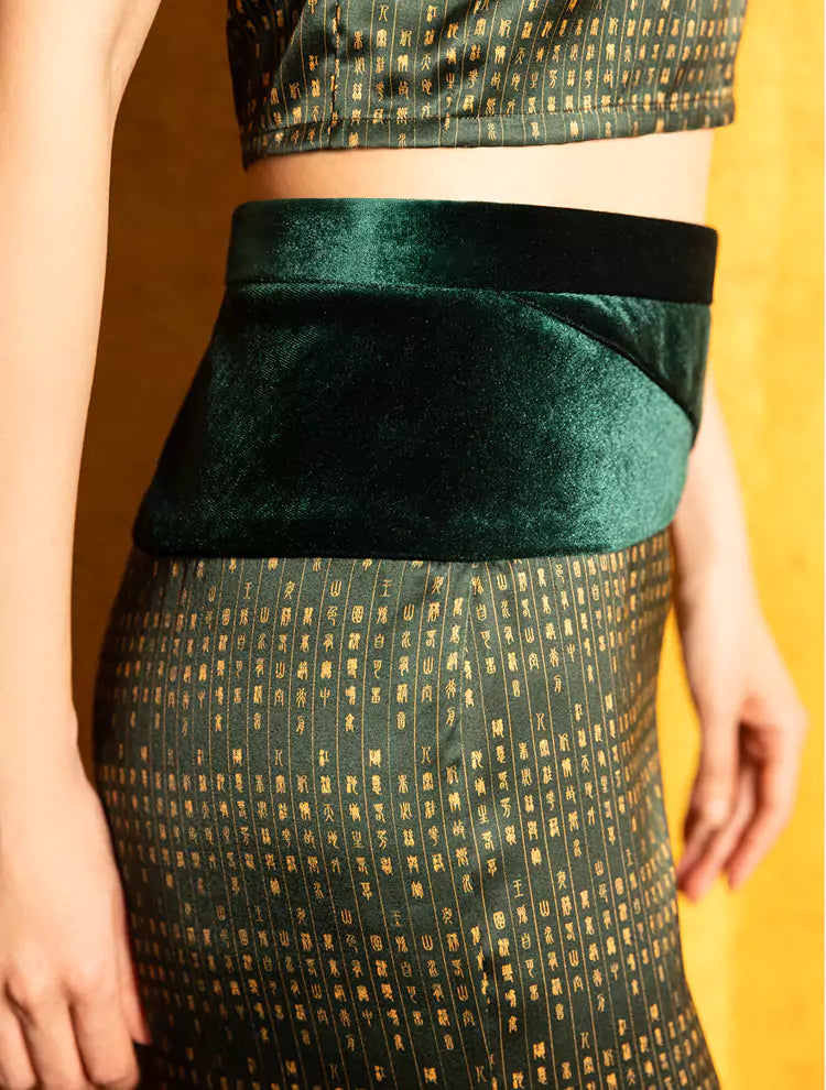 A close up of the Velvet Poem high-waisted pants which features a custom print inspired by Chinese landscape poetry and a velvet waistband. She exudes grace in this Modern Chinese chic style.