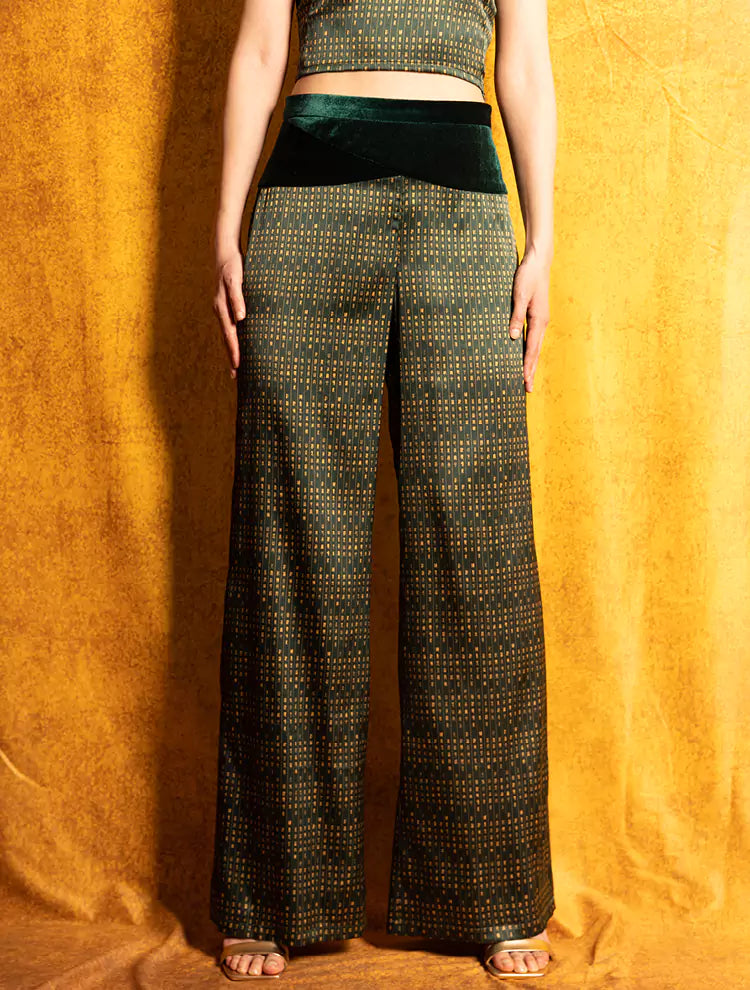 A close up of the Velvet Poem high-waisted pants which features a custom print inspired by Chinese landscape poetry and a velvet waistband. She exudes grace in this Modern Chinese chic style. 