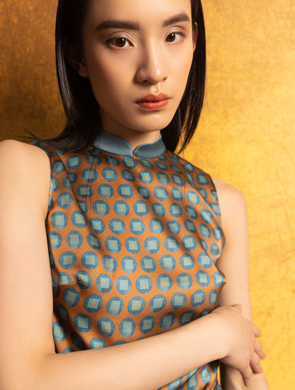 A women wears a silk sleeveless top featuring a custom print and Mandarin collar, exuding grace in a Modern Chinese chic style.